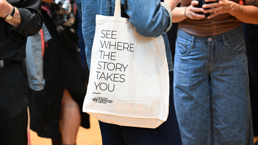 image of a tote bag saying "see where the story takes you"